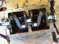 Partial assembly of crankshaft and Big End Bearings and Caps. Partial assembly of crankshaft and Big End Bearings and Caps.