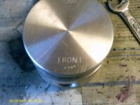 'Front' of piston,towards radiator.