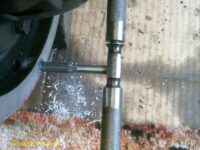 Tapping a bell-housing hole.