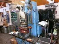 Cylinder block mounted on re-boring machine.